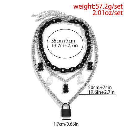 Fashionable multi-layered women's necklace with lock pendant and metal tassels