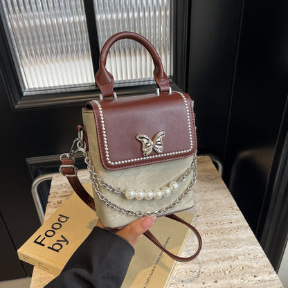 Simple women's crossbody mini bag in vertical format, portable, coin purse