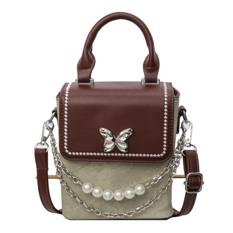 Simple women's crossbody mini bag in vertical format, portable, coin purse