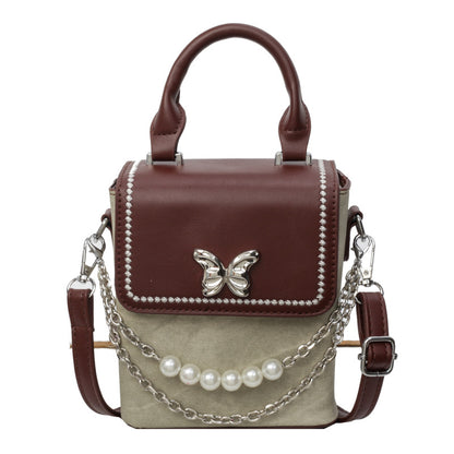 Simple women's crossbody mini bag in vertical format, portable, coin purse