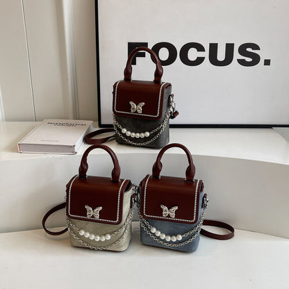 Simple women's crossbody mini bag in vertical format, portable, coin purse