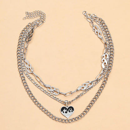 Striking multi-layered women's necklace with flame and heart motif