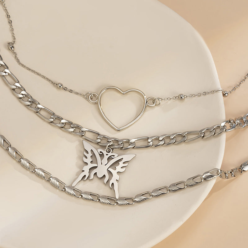 Multi-layered statement necklace with butterfly pendant and heart choker for women
