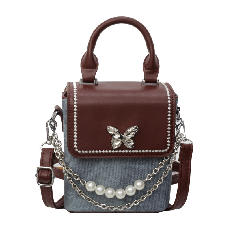 Simple women's crossbody mini bag in vertical format, portable, coin purse