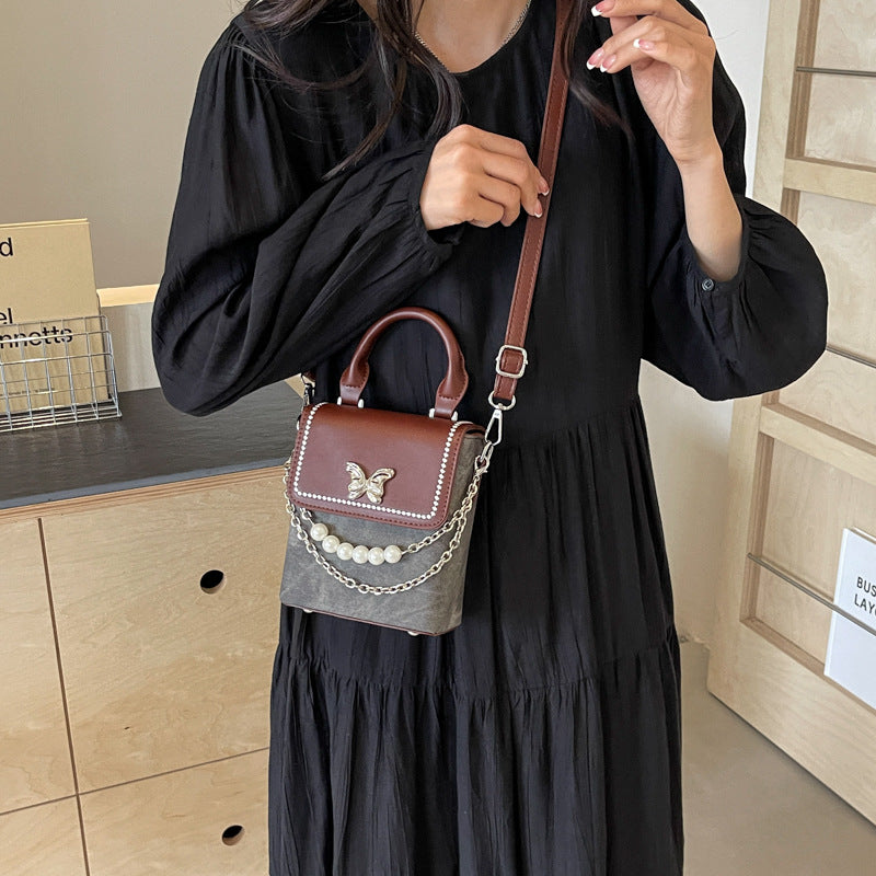 Simple women's crossbody mini bag in vertical format, portable, coin purse