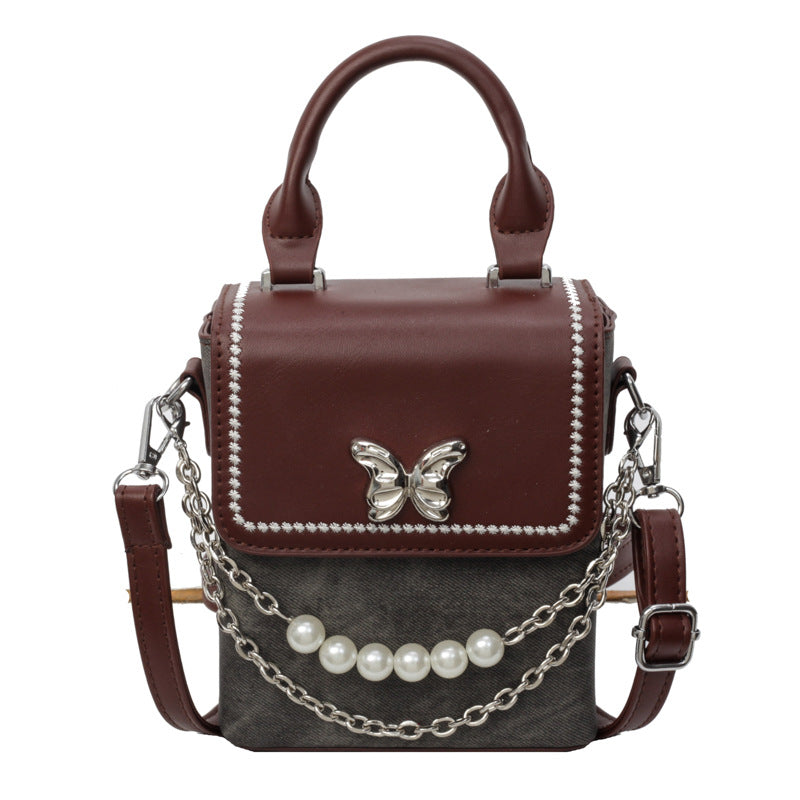 Simple women's crossbody mini bag in vertical format, portable, coin purse