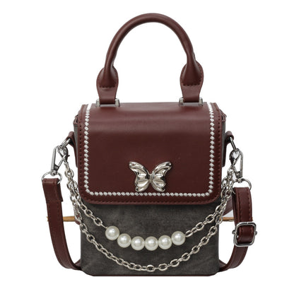 Simple women's crossbody mini bag in vertical format, portable, coin purse