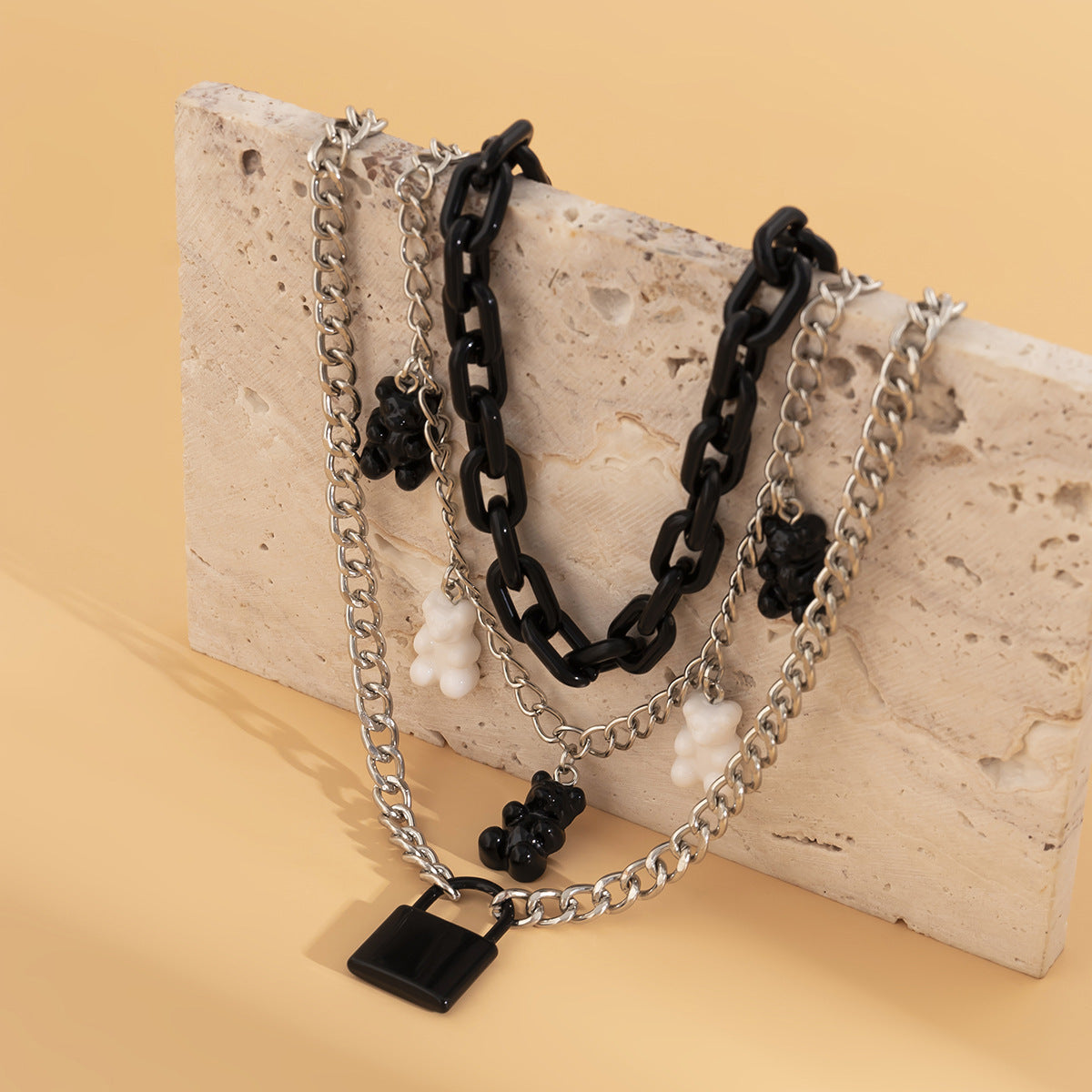 Fashionable multi-layered women's necklace with lock pendant and metal tassels