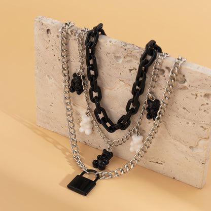 Fashionable multi-layered women's necklace with lock pendant and metal tassels