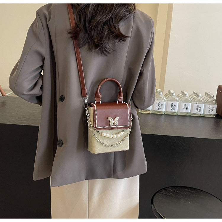 Simple women's crossbody mini bag in vertical format, portable, coin purse