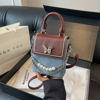 Simple women's crossbody mini bag in vertical format, portable, coin purse