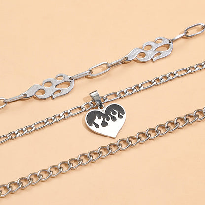 Striking multi-layered women's necklace with flame and heart motif