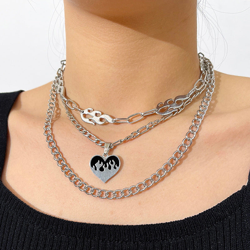 Striking multi-layered women's necklace with flame and heart motif