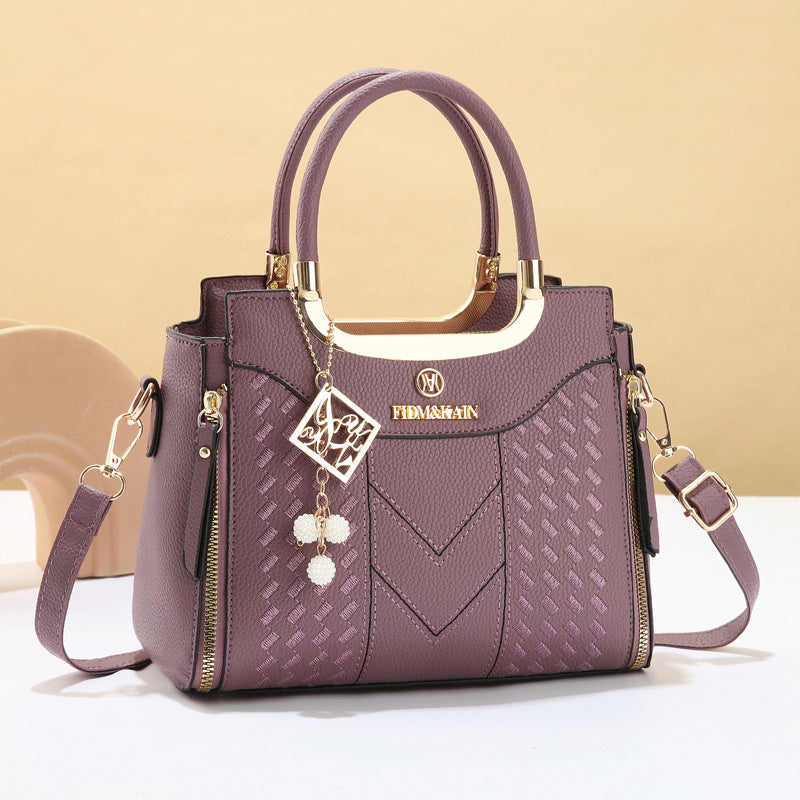 Simple women's handbag with embroidery for autumn and winter